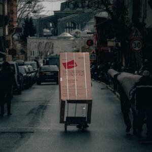 red and white box on road during daytime