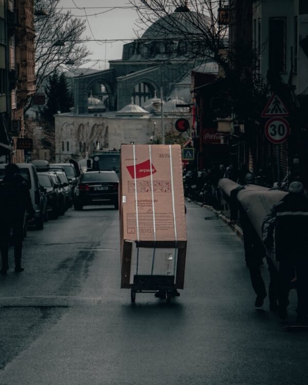 red and white box on road during daytime